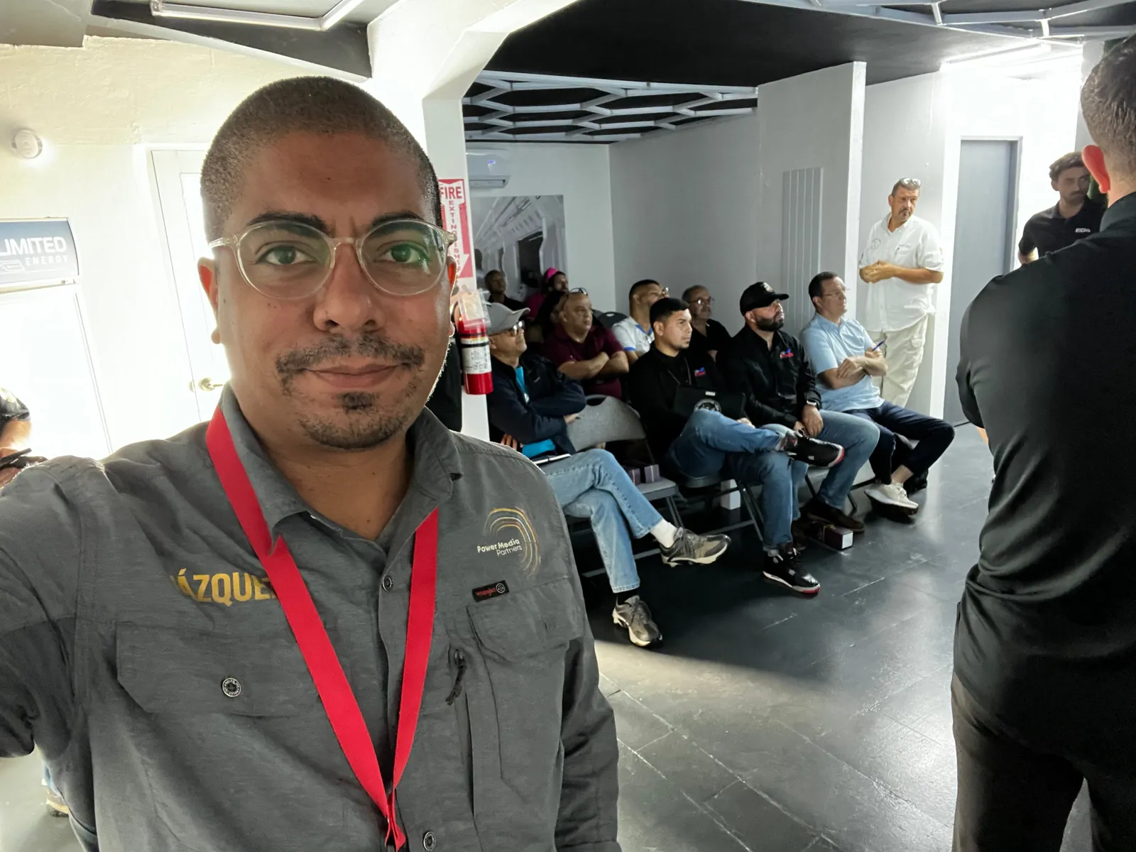Vázquez in front of a room of installers at a training in Puerto Rico